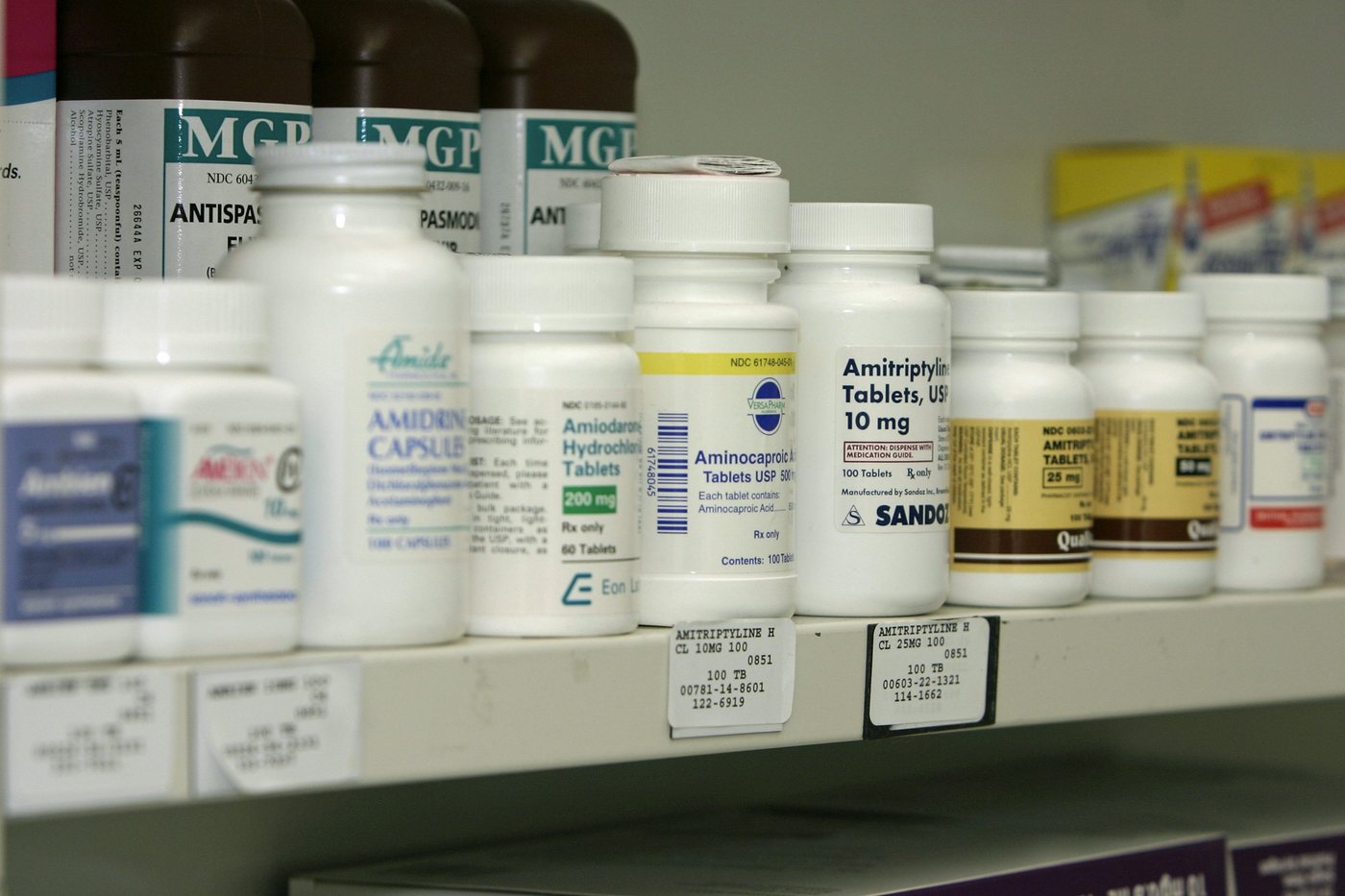 Prescription medicine bottles arranged on a pharmacy shelf in Fall River, Massachusetts.